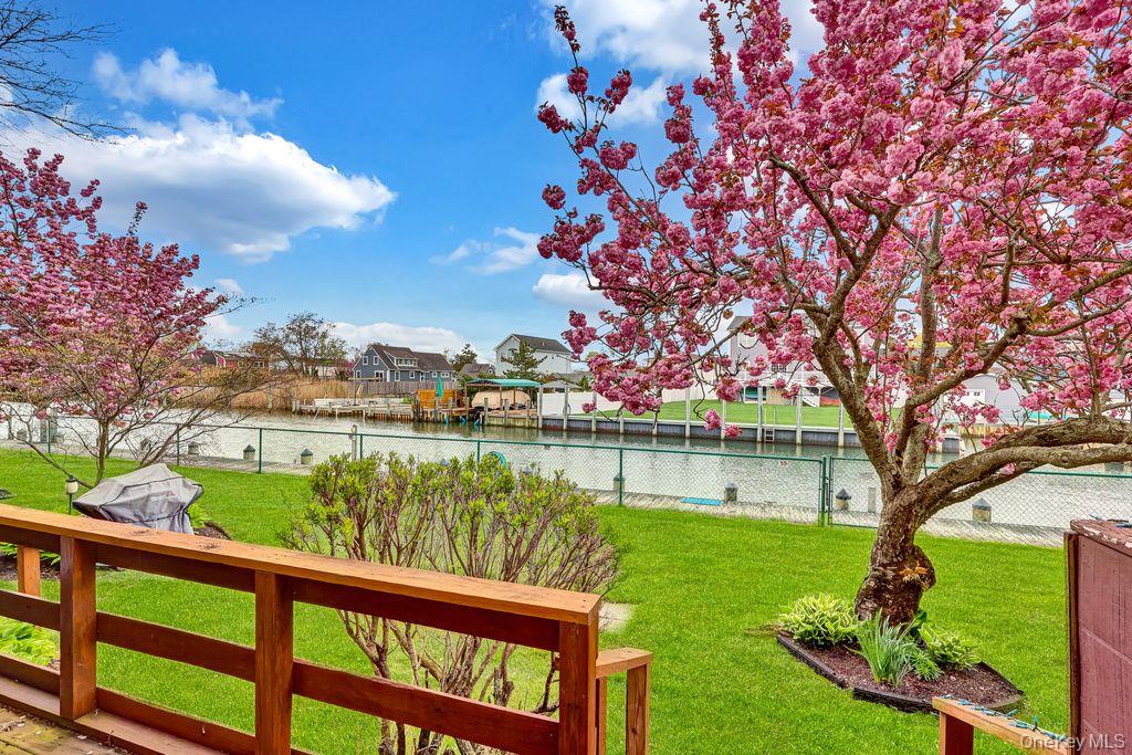 311 Mariners Way Copiague, NY 11726 - Photo 15 of 21 a view of lake from a balcony with outdoor space