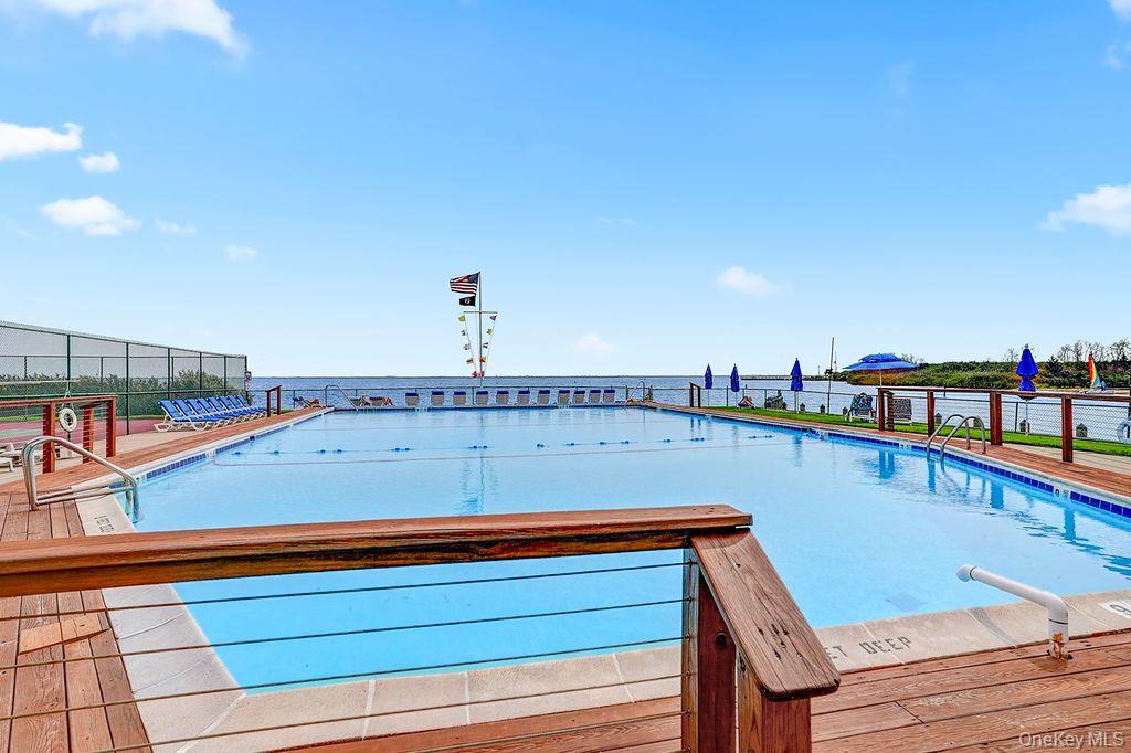 311 Mariners Way Copiague, NY 11726 - Photo 21 of 21 a view of swimming pool with seating area