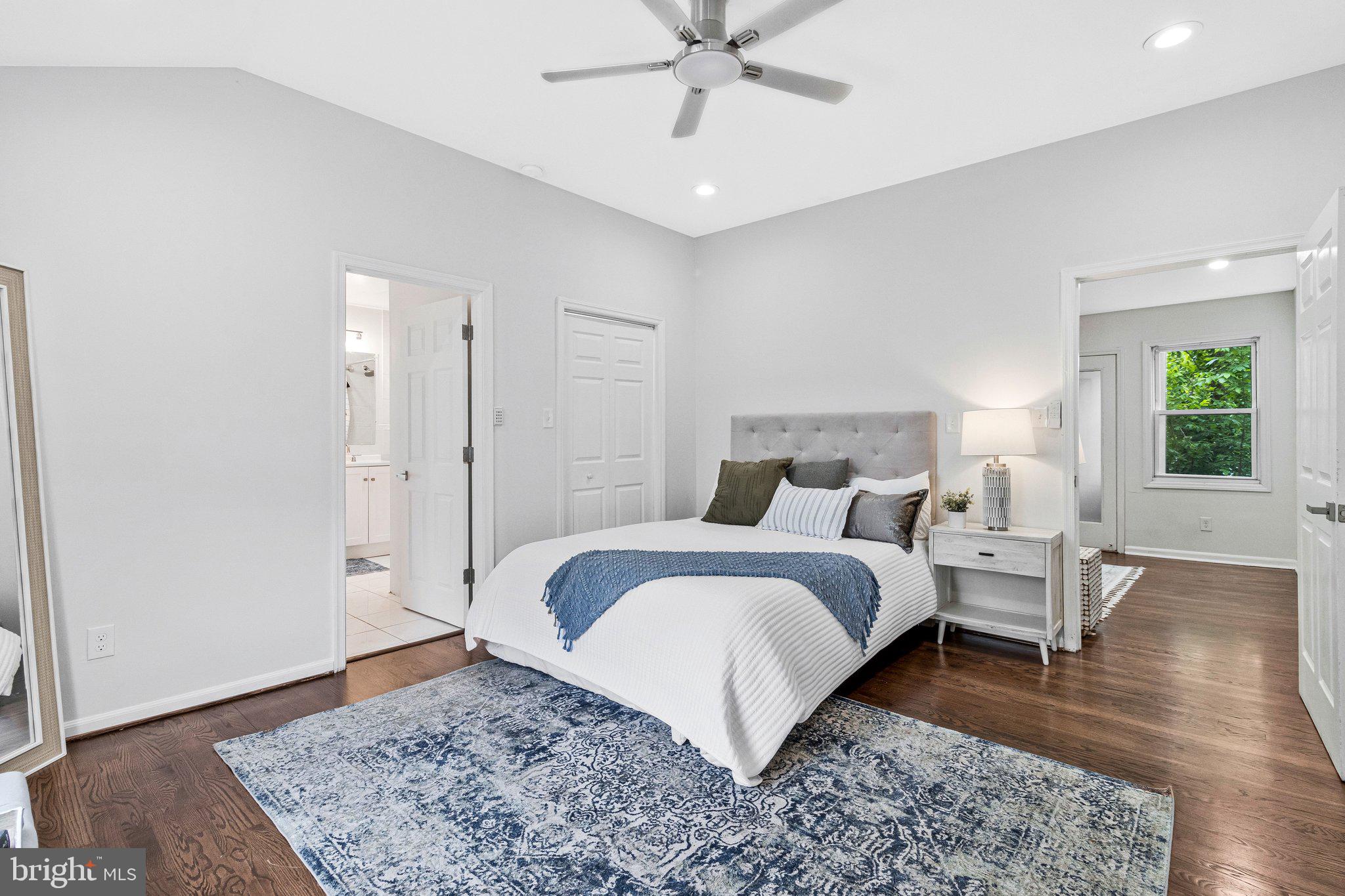 11515 Goodloe Road Silver Spring, MD 20906 - Photo 17 of 33 a spacious bedroom with a bed and wooden floor