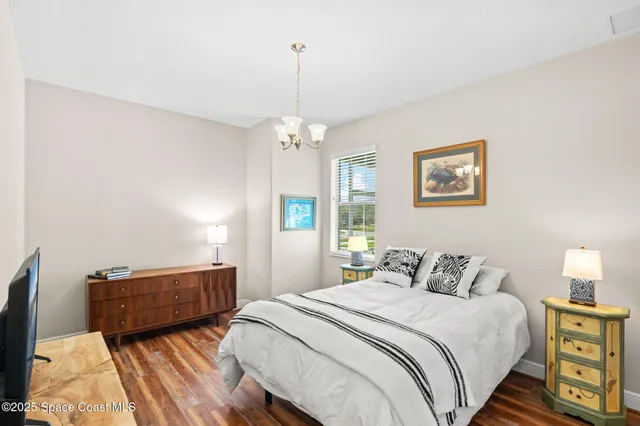 a bedroom with bed and window
