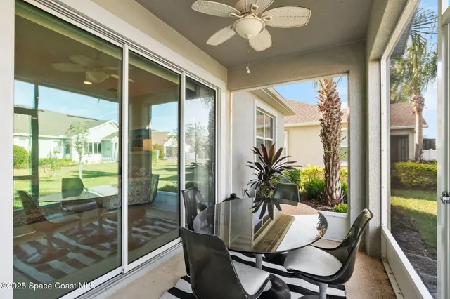 a view of a dining room with furniture window and outside view