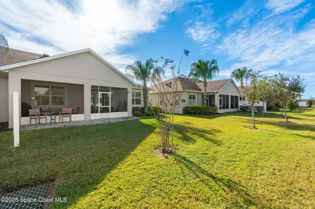 a view of house with a swimming pool