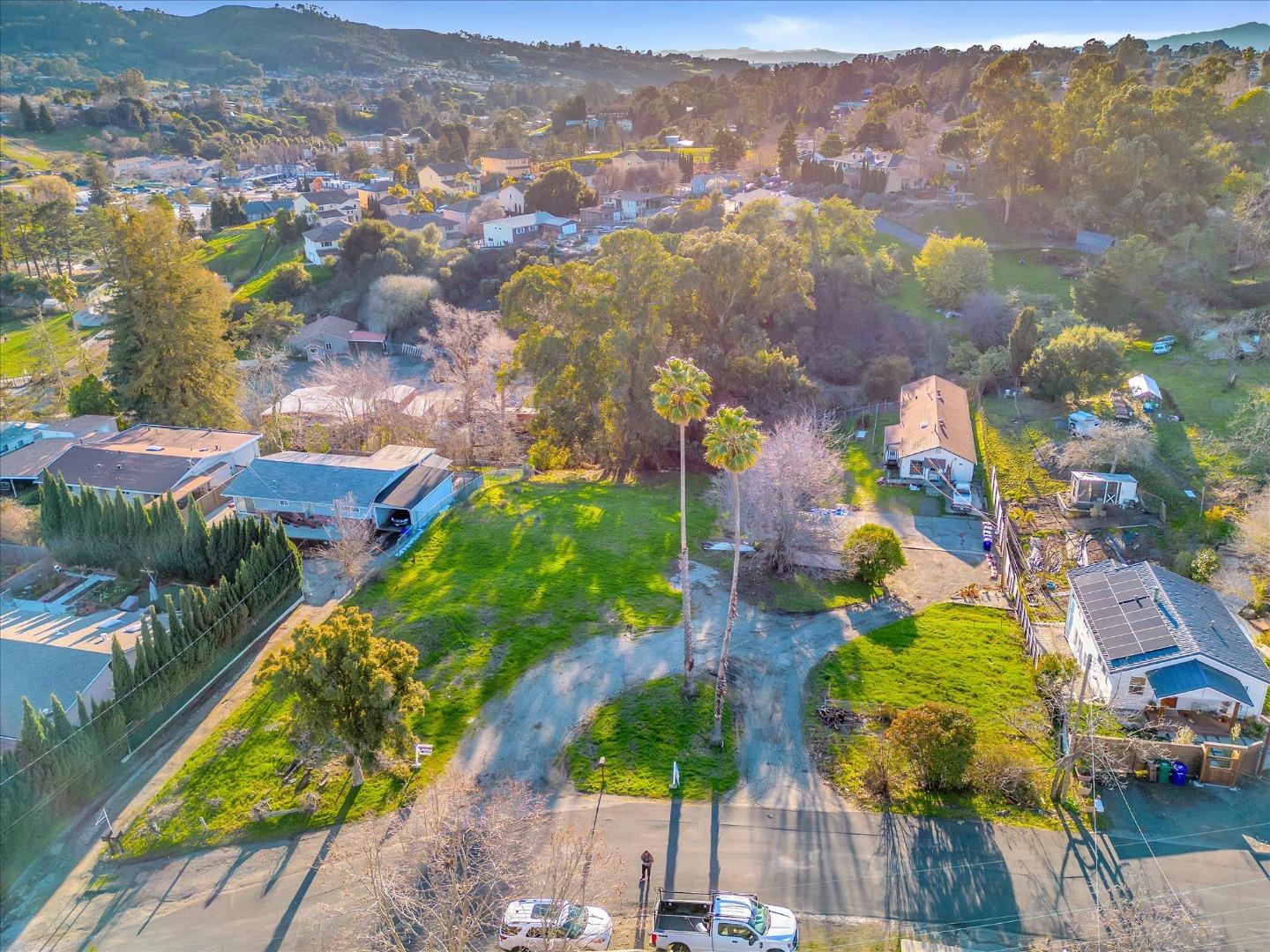 an aerial view of residential houses with outdoor space