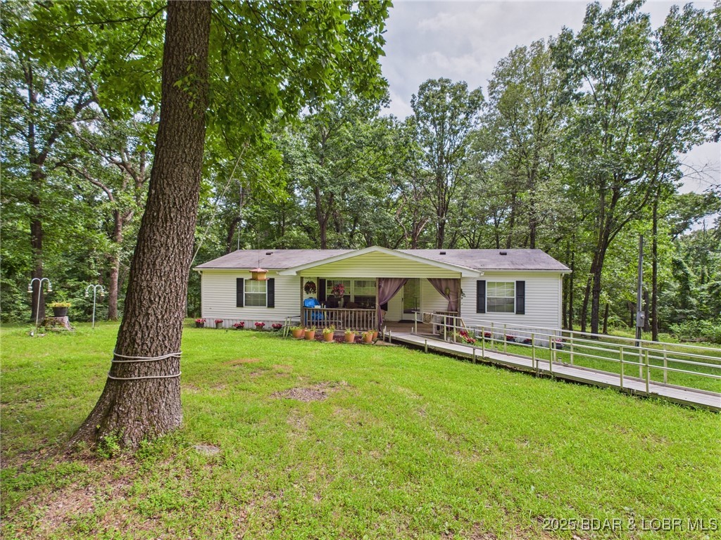 850 Pea Ridge Road Brumley, MO 65017 - Photo 1 of 1 A beautiful first impression - timeless charm and