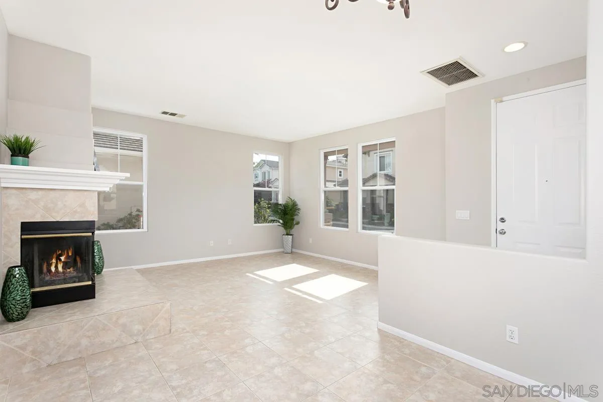 12253 Pepper Tree Lane Poway, CA 92064 - Photo 3 of 39 a view of an empty room with window and fire place