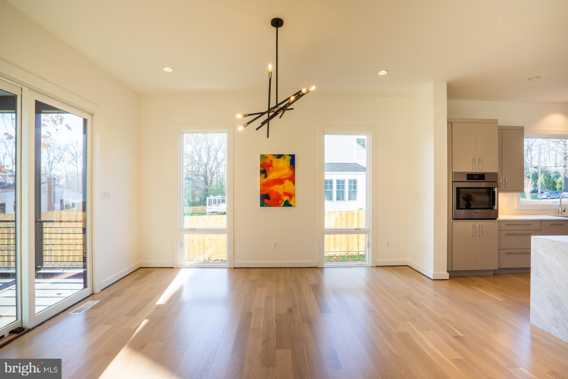 114 Tapawingo Road Southwest Vienna, VA 22180 - Photo 21 of 67 8' high windows, recessed lighting in dining space