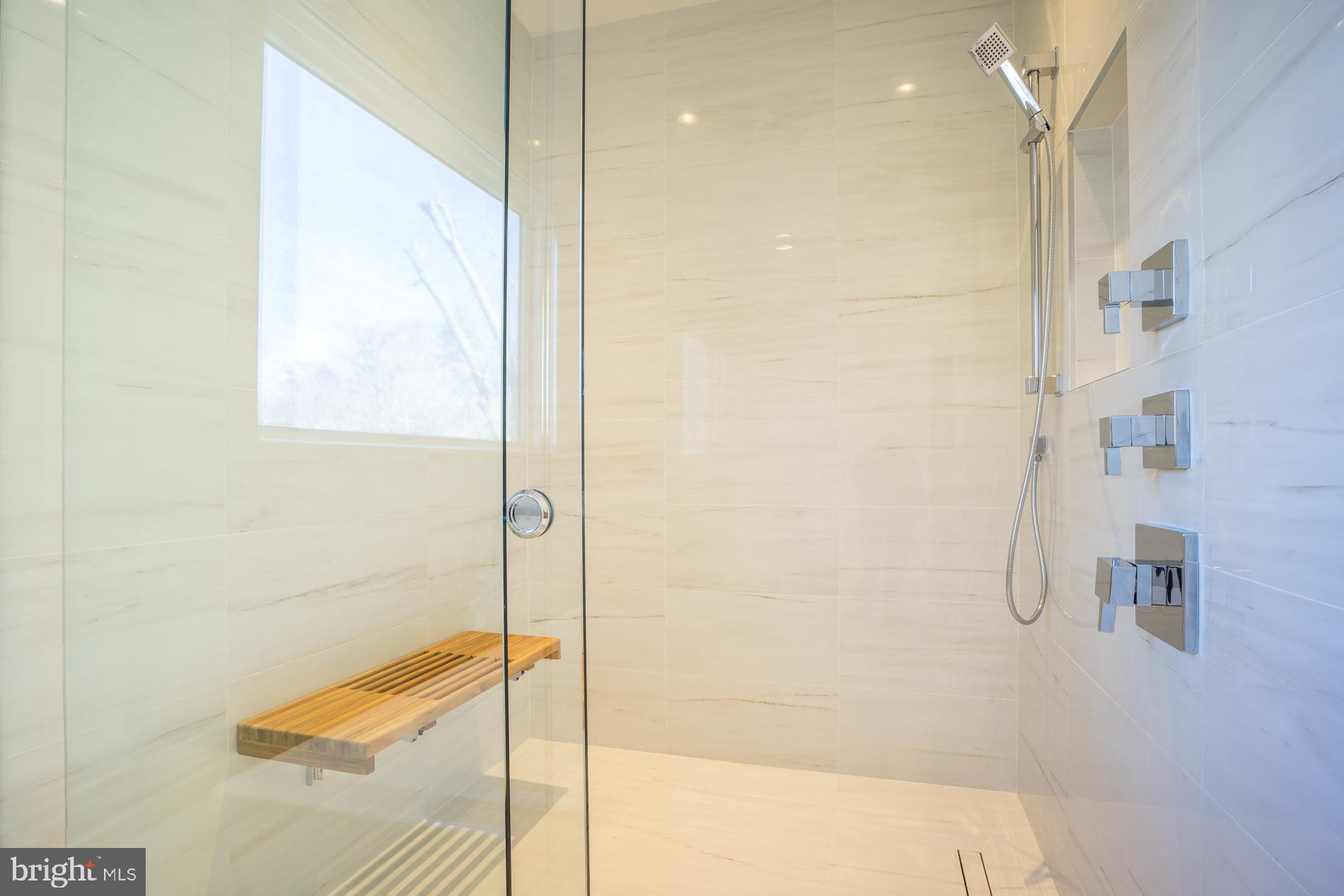 114 Tapawingo Road Southwest Vienna, VA 22180 - Photo 46 of 67 Rain head, hand held showers, teak bench