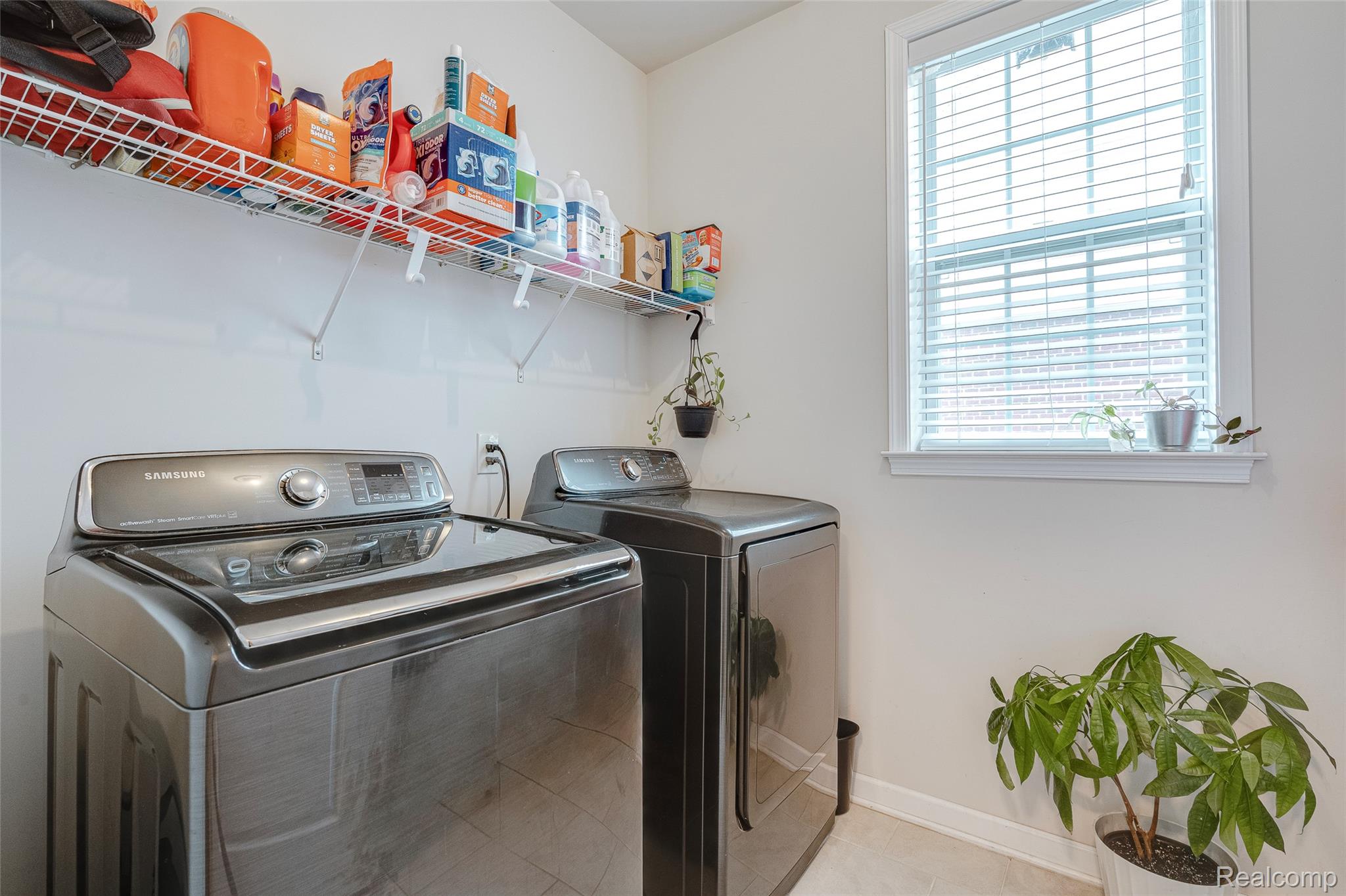 51011 Rockingham Drive Canton, MI 48188 - Photo 29 of 74 Laundry room featuring washing machine and dryer and baseboards