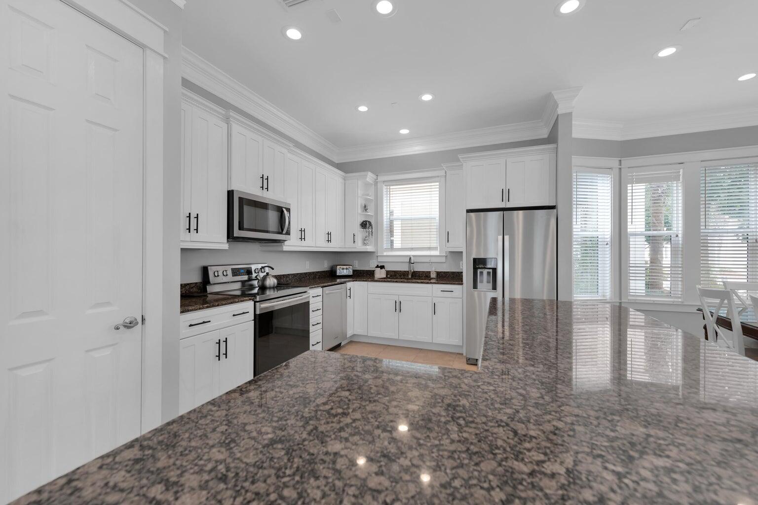 18 Beach Bike Way Inlet Beach, FL 32461 - Photo 18 of 80 a kitchen with granite countertop white cabinets and stainless steel appliances