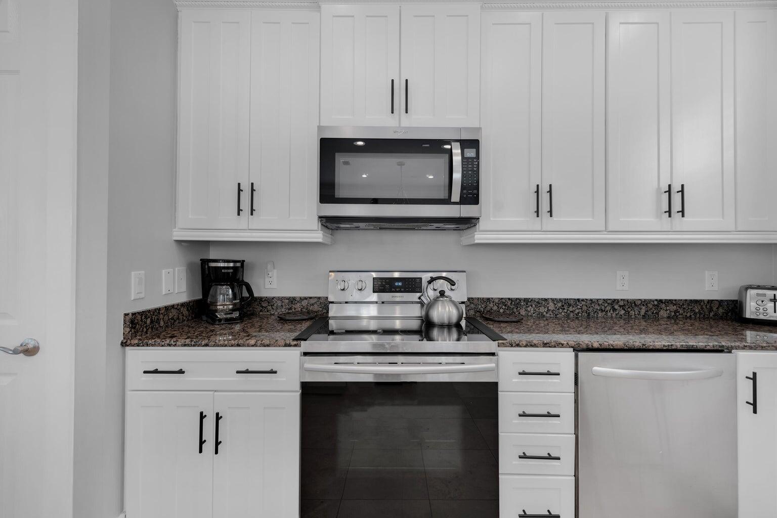 18 Beach Bike Way Inlet Beach, FL 32461 - Photo 20 of 80 a kitchen with stainless steel appliances granite countertop white cabinets granite counter tops and a hard wood floors