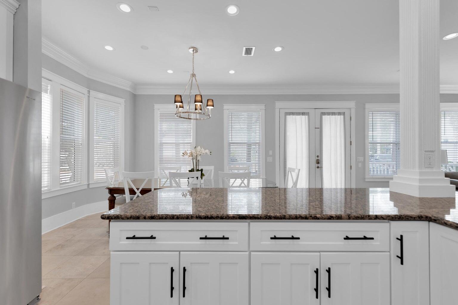 18 Beach Bike Way Inlet Beach, FL 32461 - Photo 22 of 80 a kitchen with kitchen island granite countertop white cabinets white stainless steel appliances with a sink and dishwasher