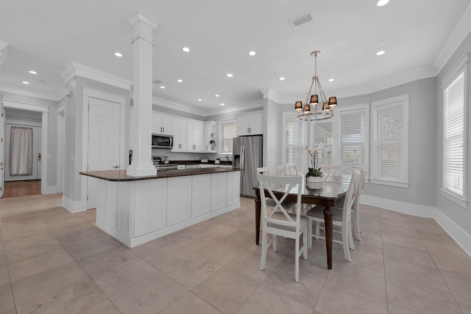 18 Beach Bike Way Inlet Beach, FL 32461 - Photo 28 of 80 a large kitchen with kitchen island a dining table and chairs