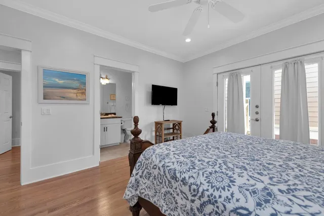 a kitchen with stainless steel appliances granite countertop a refrigerator a stove a sink and white cabinets