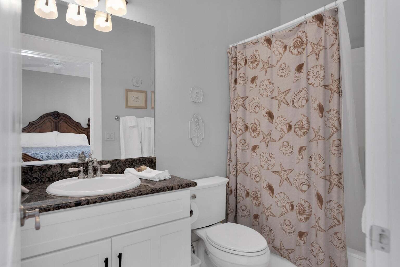 18 Beach Bike Way Inlet Beach, FL 32461 - Photo 40 of 80 a bathroom with a granite countertop sink a toilet and a mirror