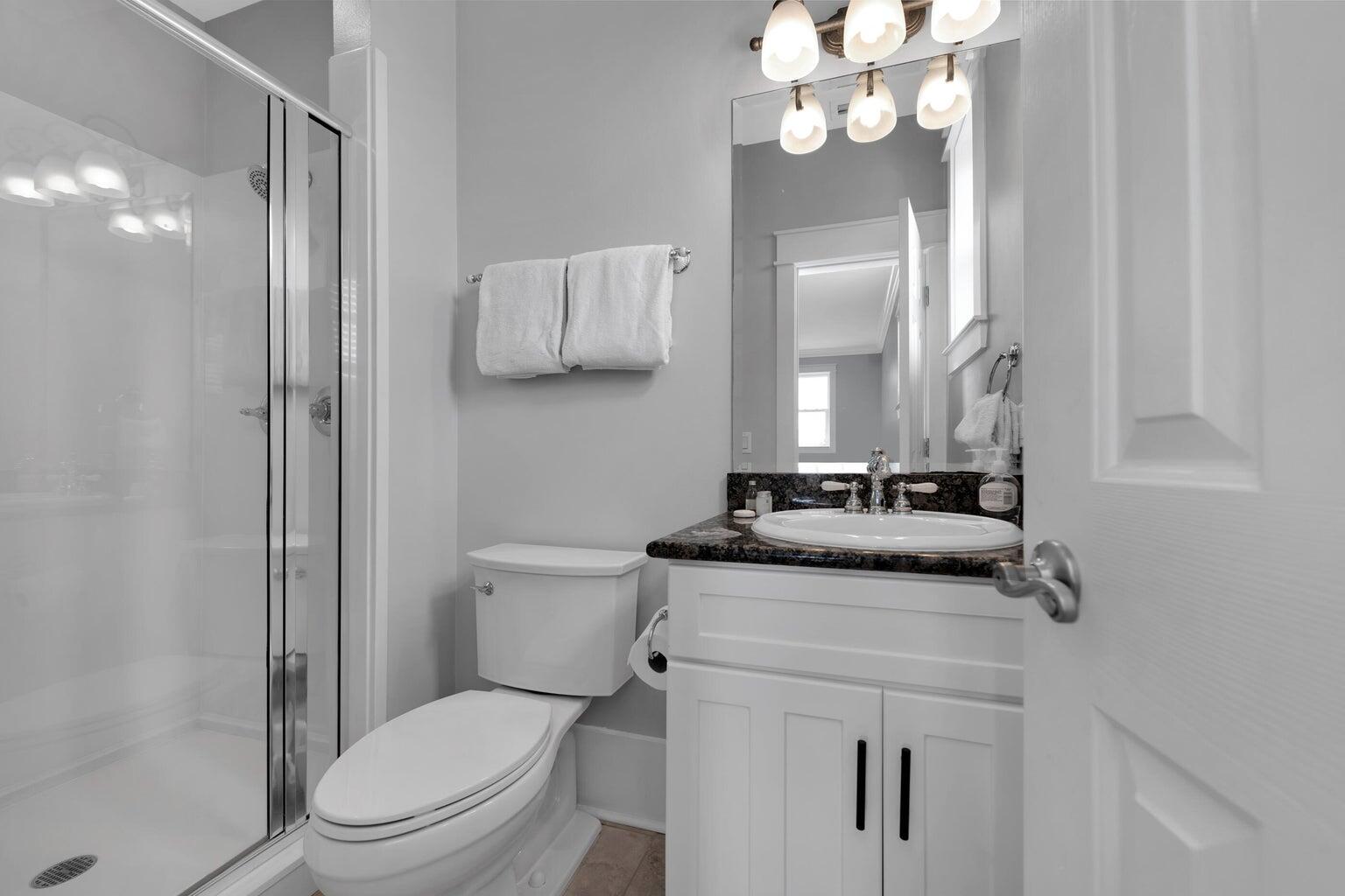 18 Beach Bike Way Inlet Beach, FL 32461 - Photo 61 of 80 a bathroom with a granite countertop sink a toilet and a mirror