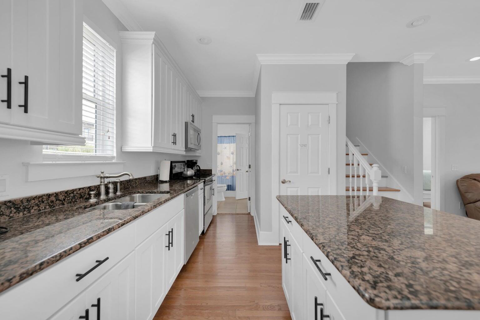18 Beach Bike Way Inlet Beach, FL 32461 - Photo 69 of 80 a large kitchen with granite countertop a sink and dishwasher a stove with wooden floor