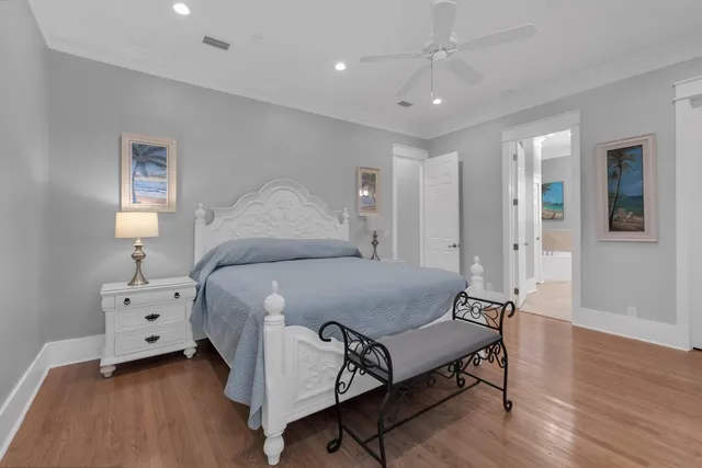 a kitchen with kitchen island granite countertop white cabinets white stainless steel appliances with a sink and dishwasher