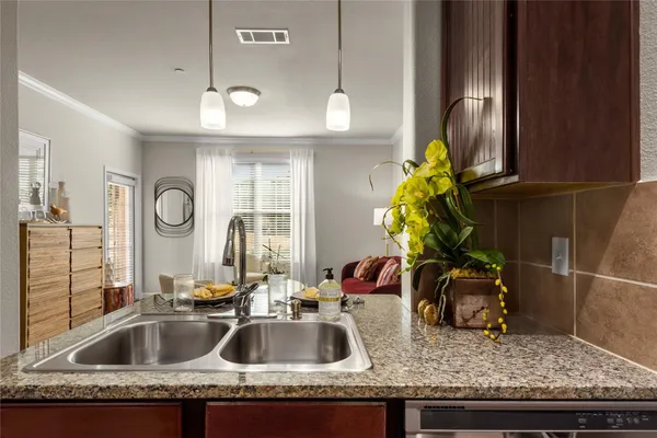 a kitchen with a sink and a refrigerator