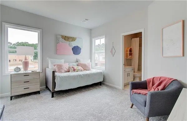 a bedroom with furniture and a window