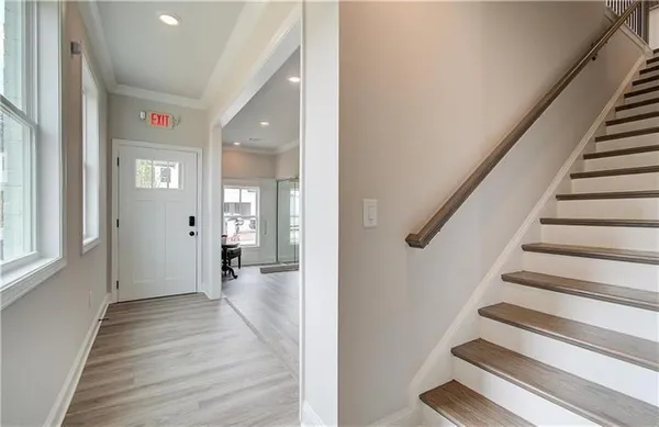 a view of an entryway with wooden floor