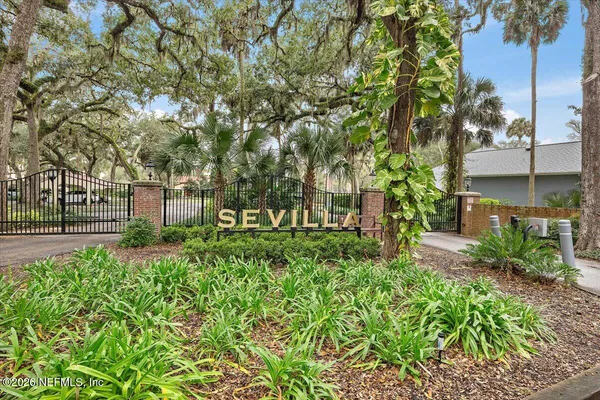 a view of a park that has large trees