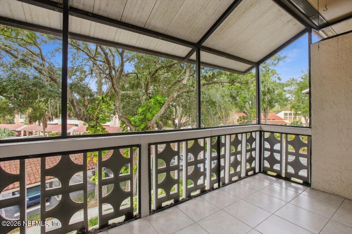 1810 Sevilla Boulevard West, Unit 310 Atlantic Beach, FL 32233 - Photo 14 of 18 a view of a porch with a wooden floor