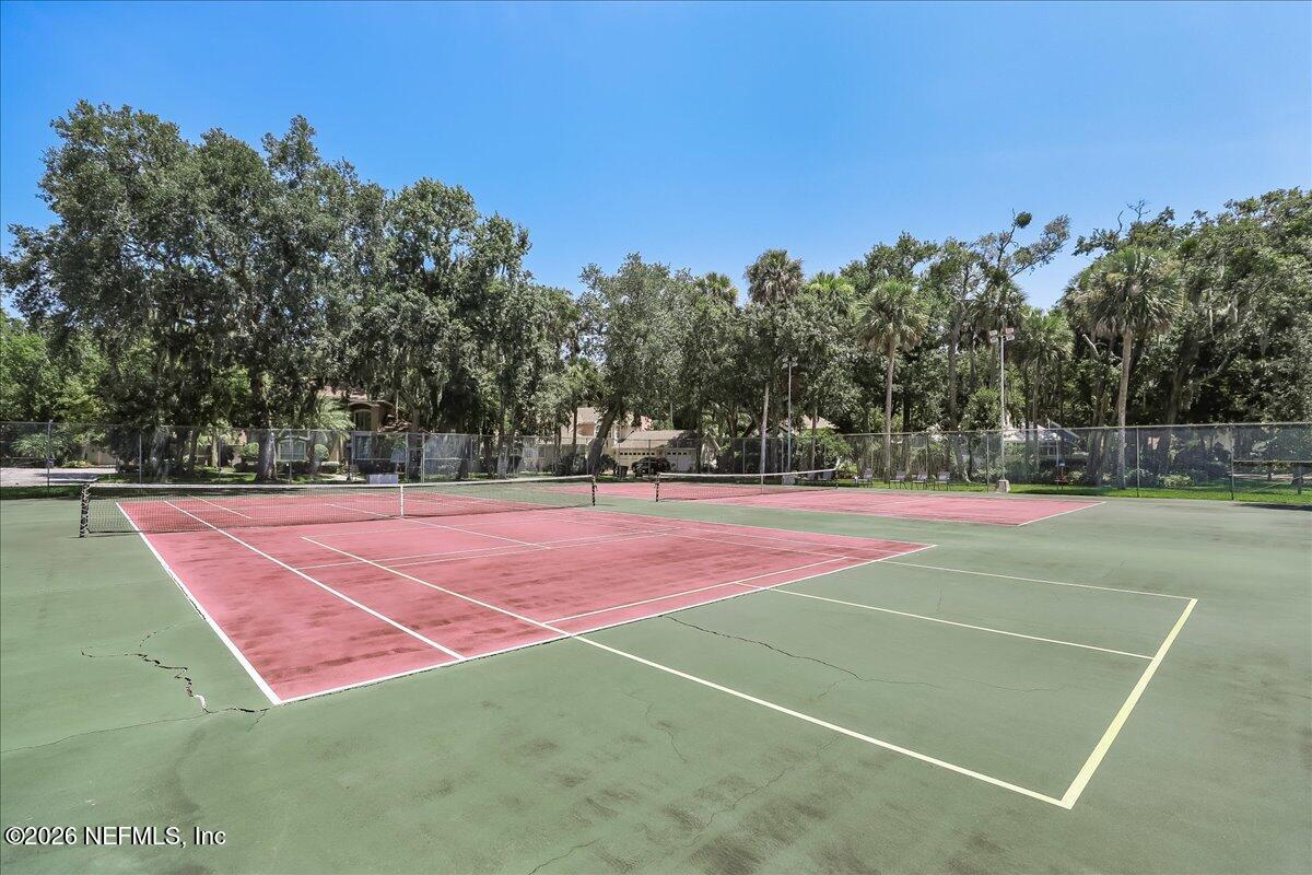 1810 Sevilla Boulevard West, Unit 310 Atlantic Beach, FL 32233 - Photo 16 of 18 a tennis court that has tennis net