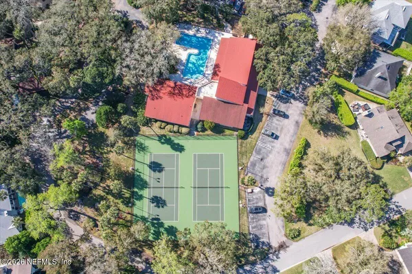 an aerial view of residential house with outdoor space and swimming pool