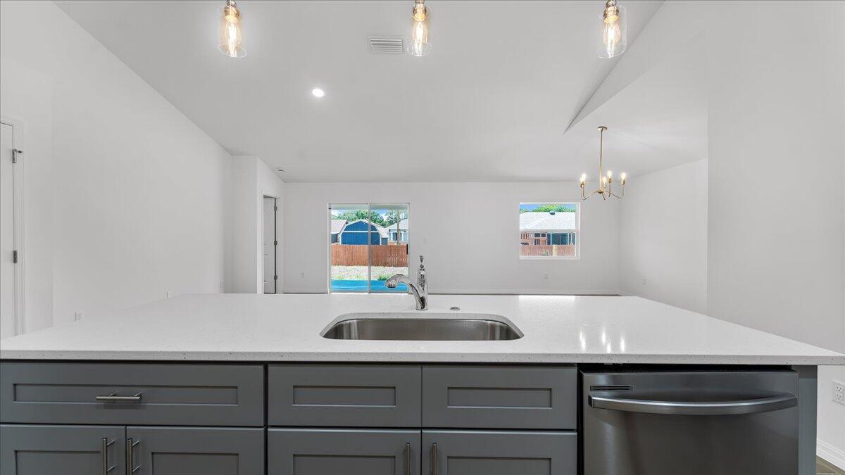 1938 Jupiter Boulevard Southwest Palm Bay, FL 32908 - Photo 14 of 41 a bathroom with a sink and a mirror