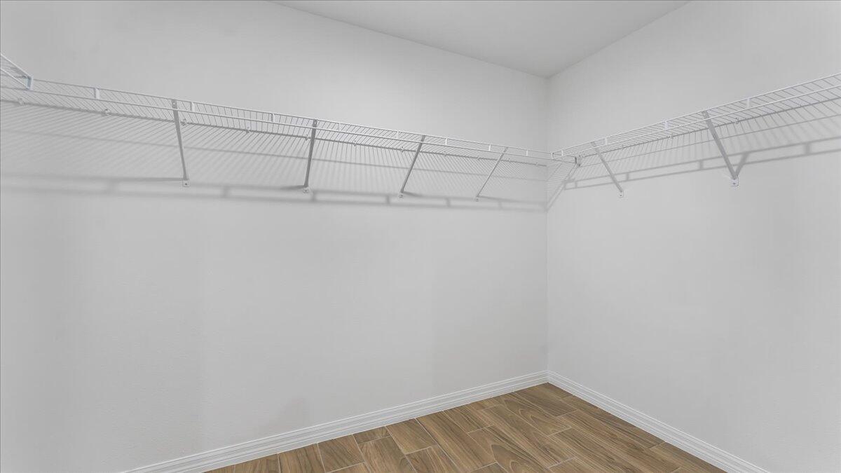 1938 Jupiter Boulevard Southwest Palm Bay, FL 32908 - Photo 22 of 41 a view of a room with racks on the wall