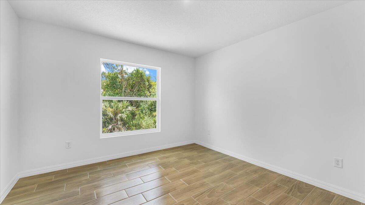 1938 Jupiter Boulevard Southwest Palm Bay, FL 32908 - Photo 26 of 41 an empty room with a window