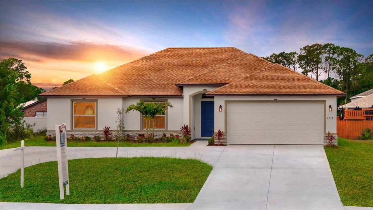 1938 Jupiter Boulevard Southwest Palm Bay, FL 32908 - Photo 3 of 41 a front view of house with yard and green space