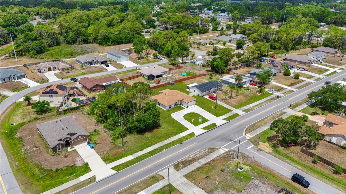 1938 Jupiter Boulevard Southwest Palm Bay, FL 32908 - Photo 36 of 41 an aerial view of a residential houses with outdoor space