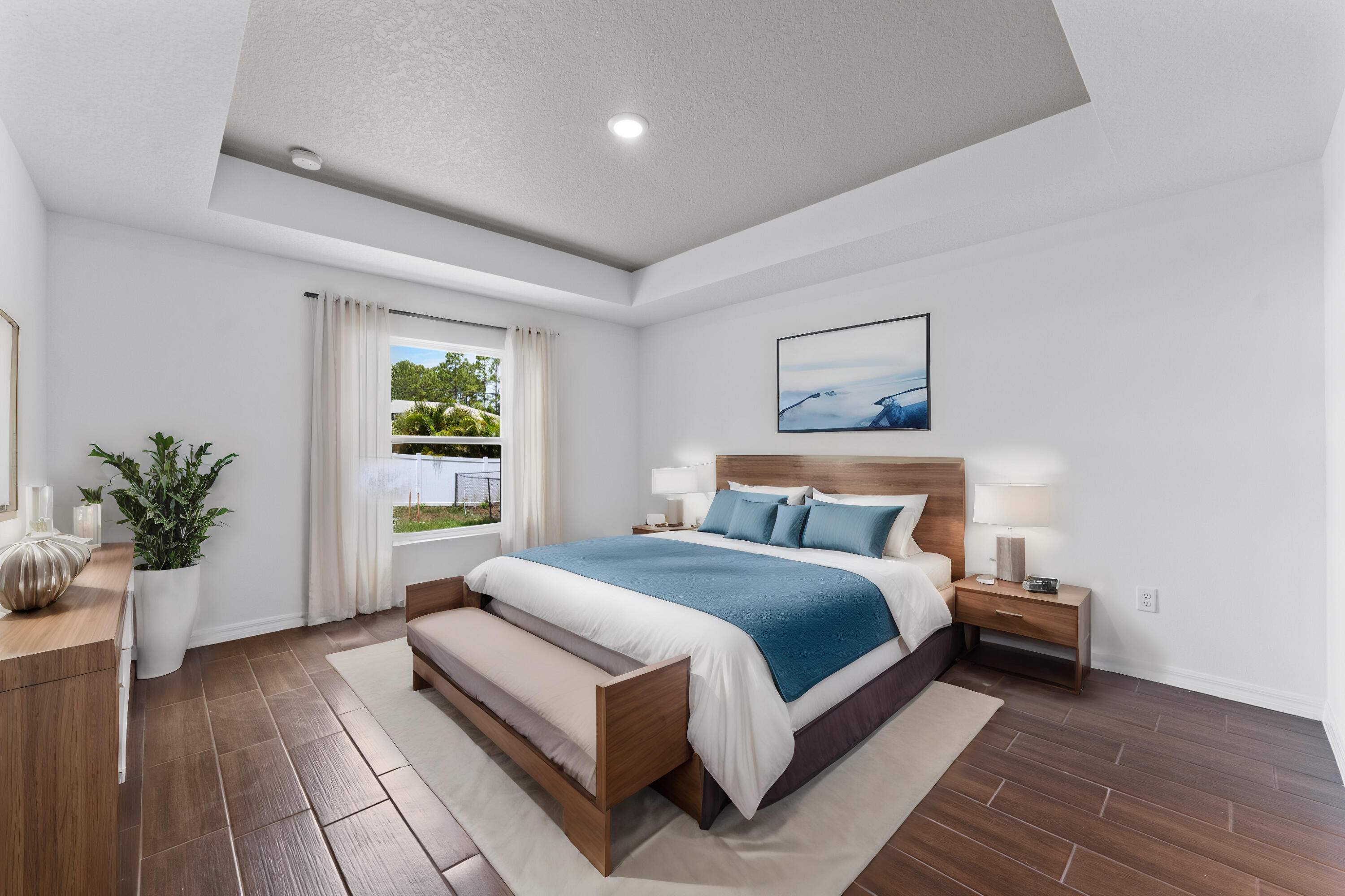 1938 Jupiter Boulevard Southwest Palm Bay, FL 32908 - Photo 40 of 41 a bedroom with a large bed and a potted plant