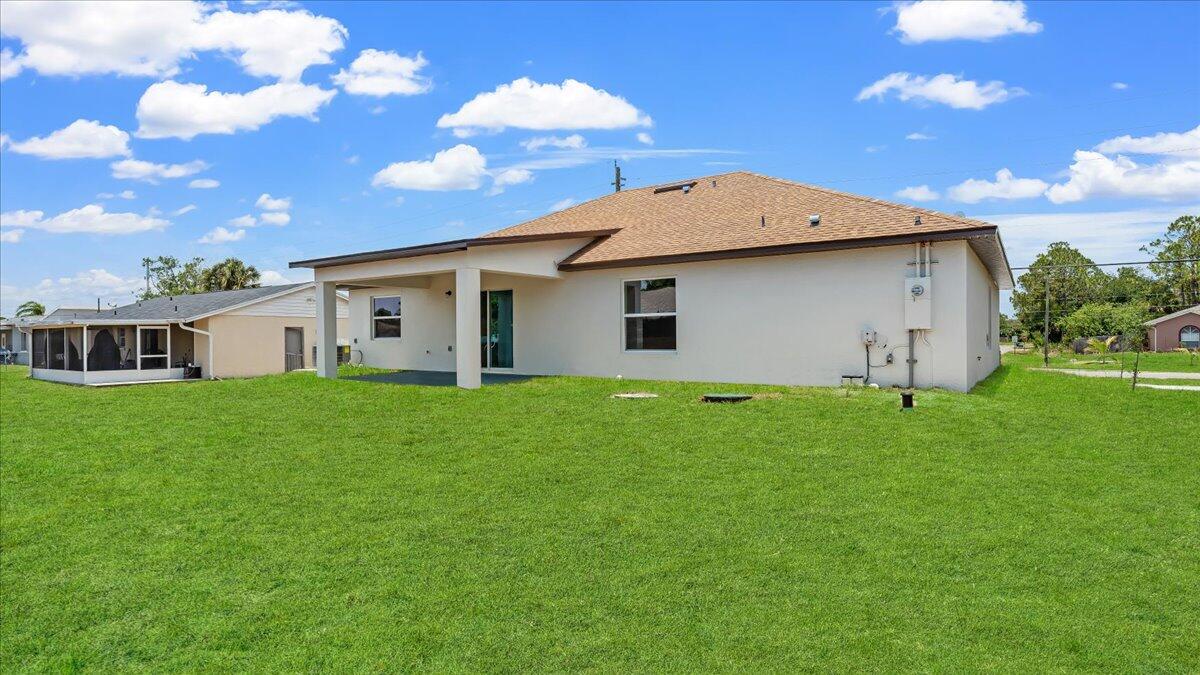 1938 Jupiter Boulevard Southwest Palm Bay, FL 32908 - Photo 7 of 41 a view of a house with a backyard