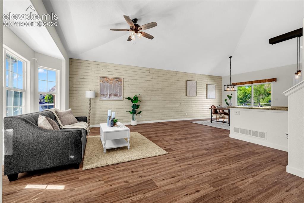 11185 Falling Star Road Fountain, CO 80817 - Photo 2 of 46 a living room with furniture and a wooden floor