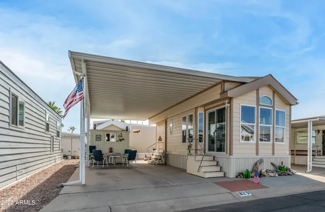 a front view of a house with a sitting area