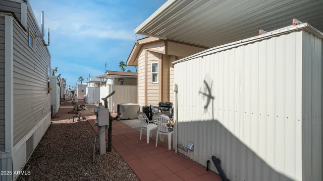 a backyard of a house with outdoor seating