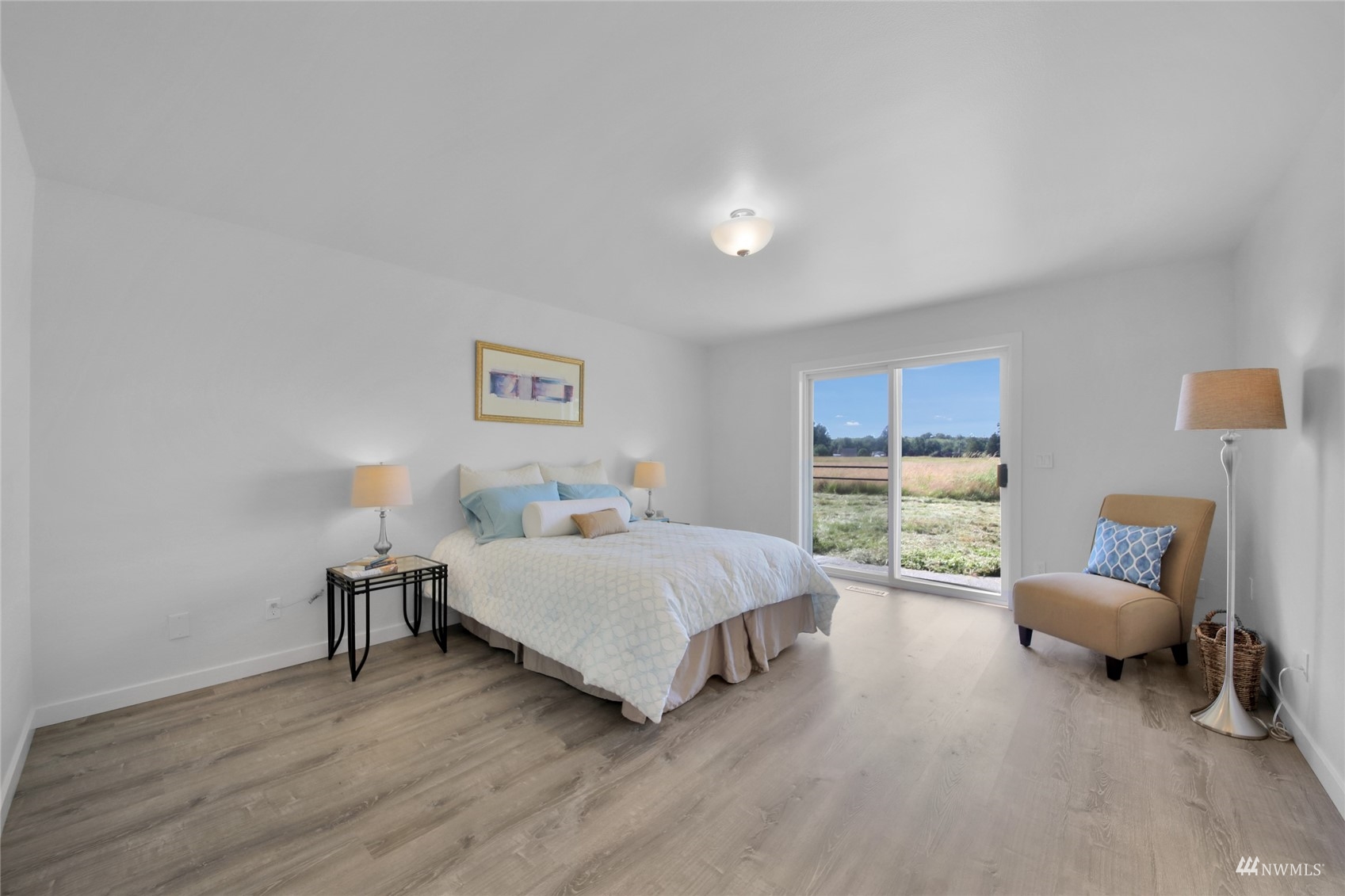 4770 Lincoln Road Blaine, WA 98230 - Photo 11 of 36 a spacious bedroom with a bed and a couch