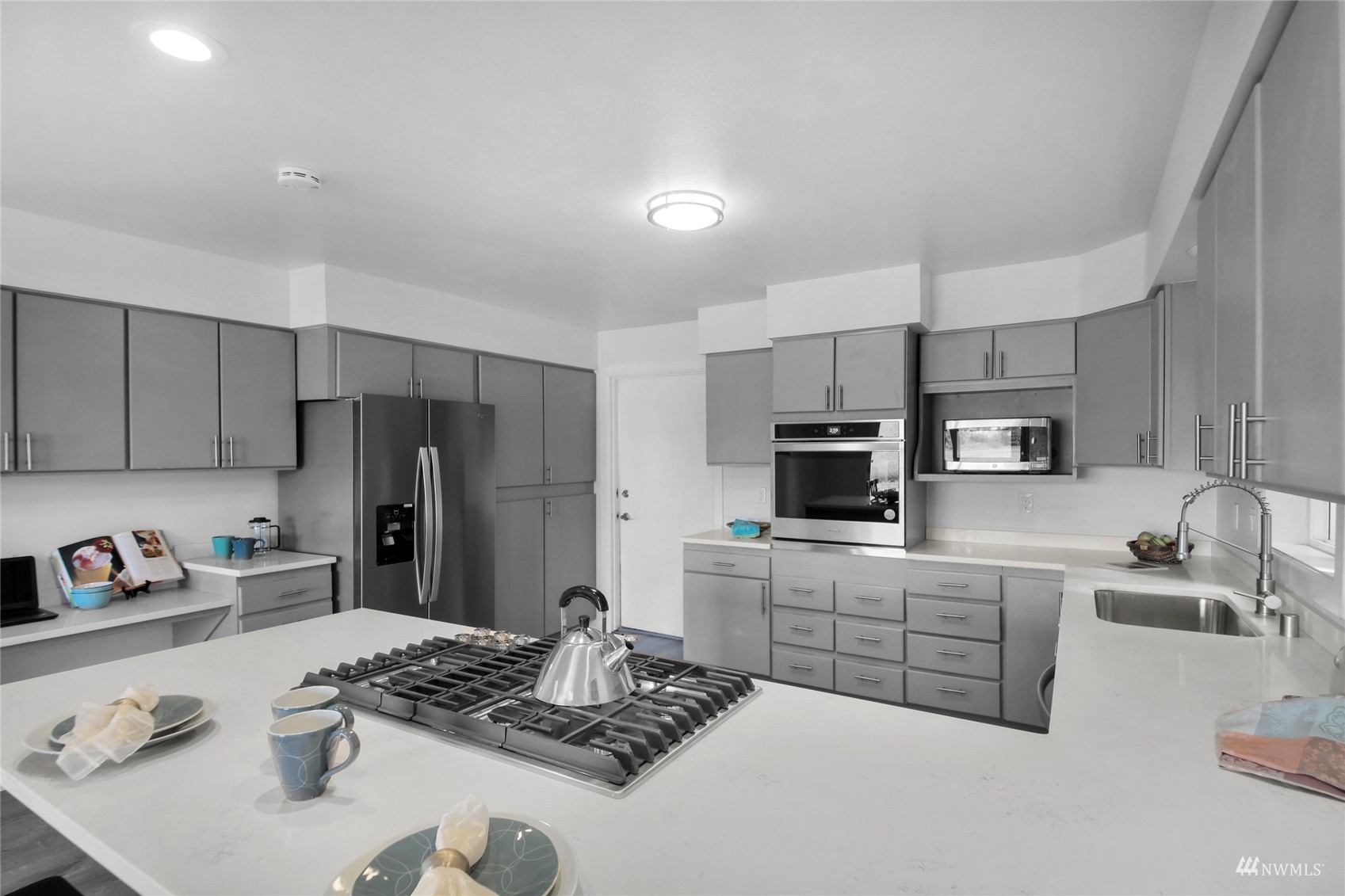 4770 Lincoln Road Blaine, WA 98230 - Photo 20 of 36 a kitchen with stainless steel appliances granite countertop a sink stove and refrigerator