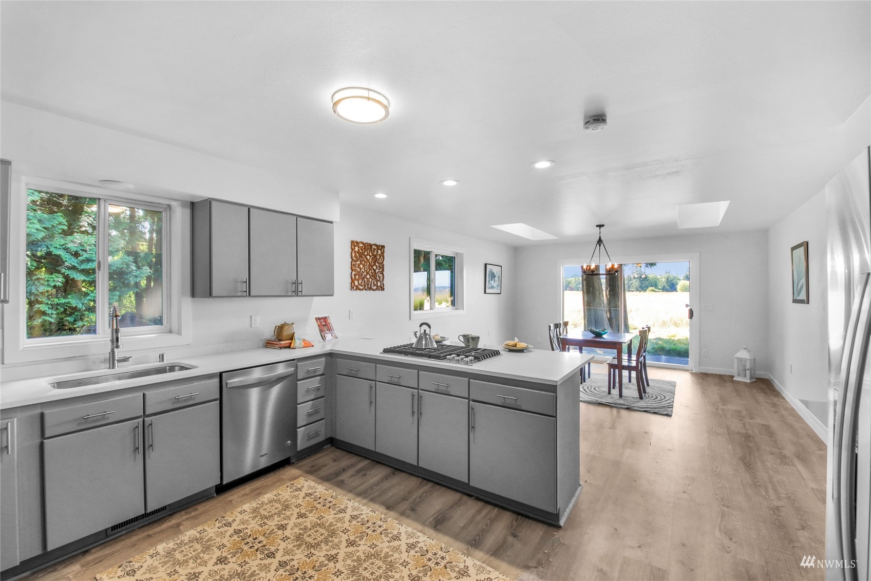4770 Lincoln Road Blaine, WA 98230 - Photo 21 of 36 a large kitchen with a sink and cabinets