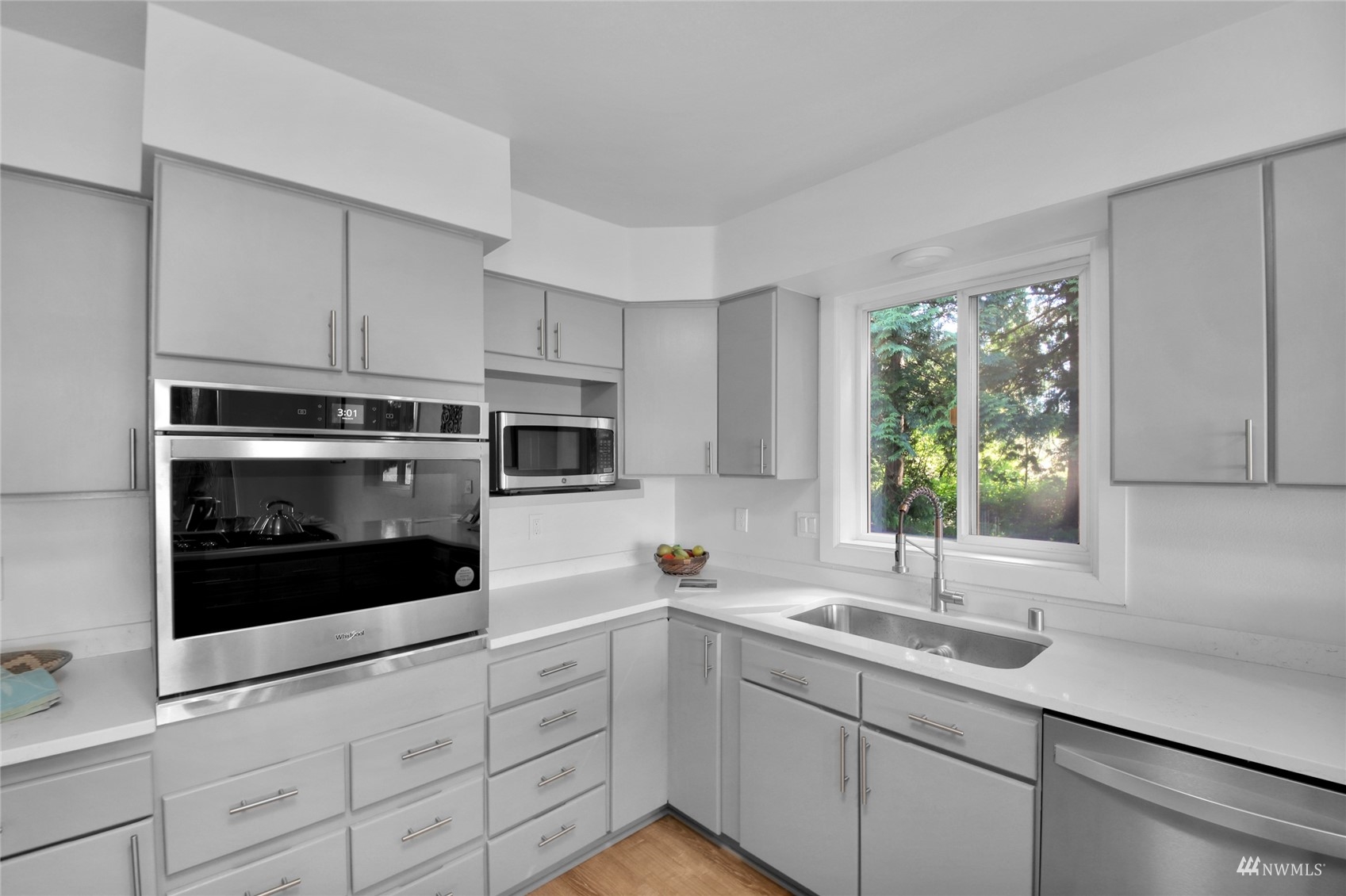 4770 Lincoln Road Blaine, WA 98230 - Photo 23 of 36 a kitchen with stainless steel appliances a sink a stove and cabinets