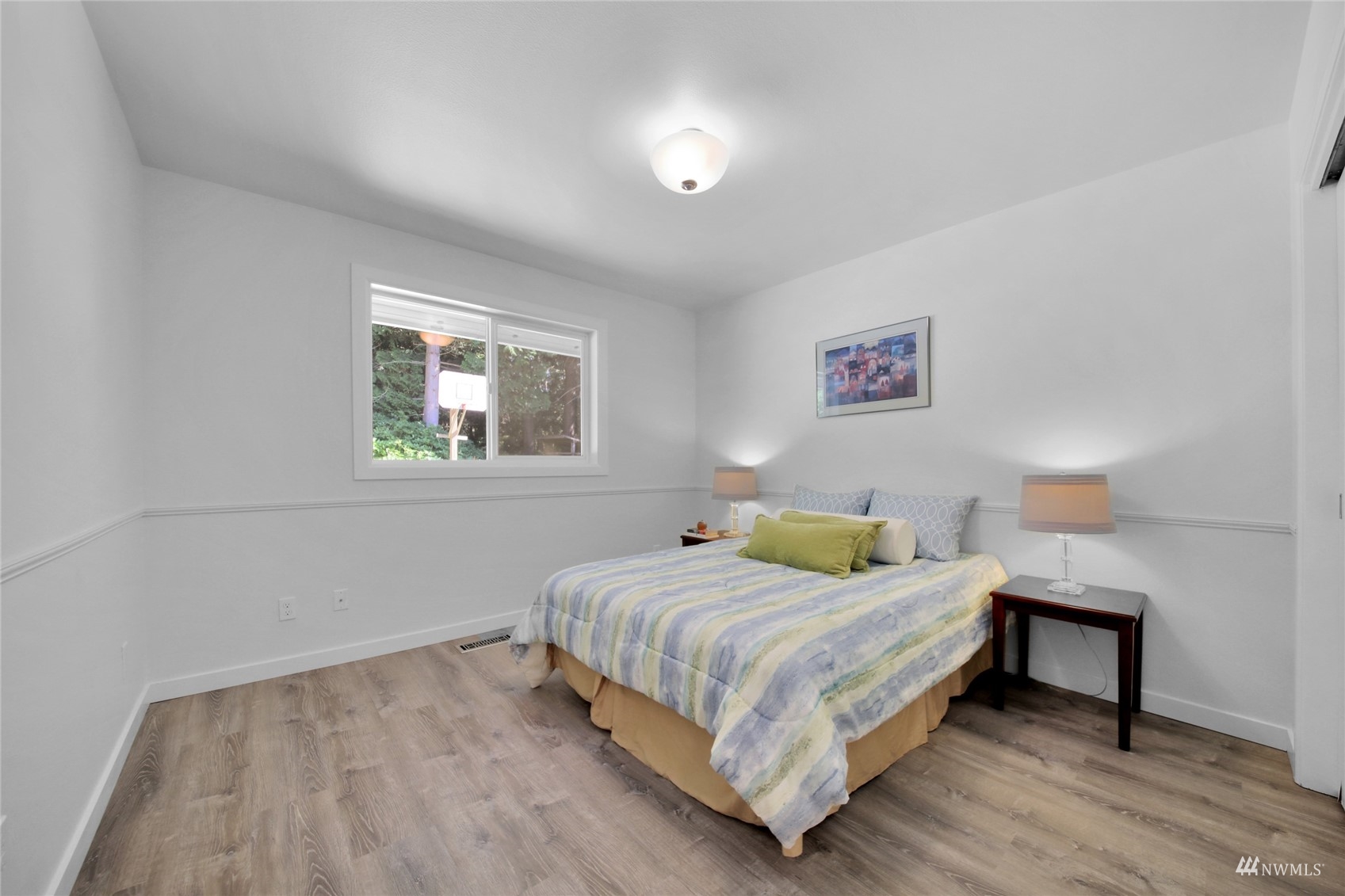 4770 Lincoln Road Blaine, WA 98230 - Photo 8 of 36 a bedroom with a bed and a night stand