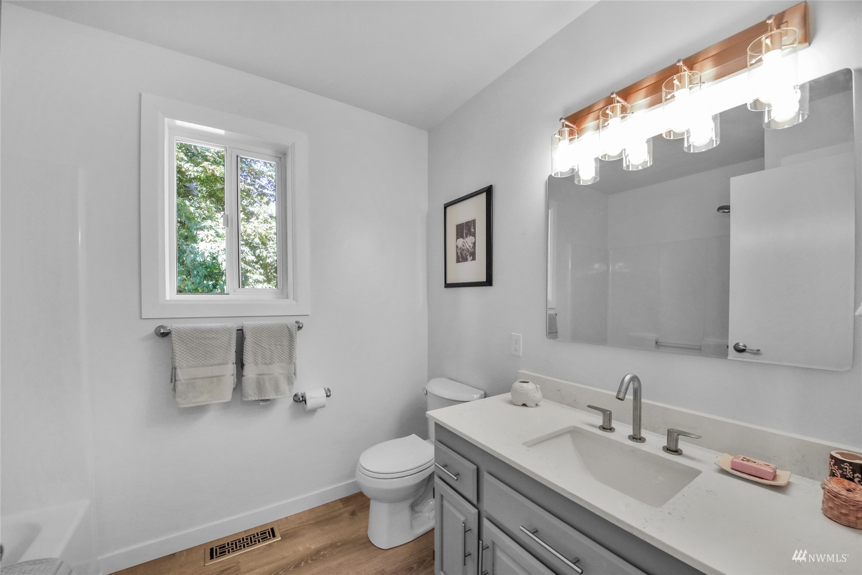 4770 Lincoln Road Blaine, WA 98230 - Photo 10 of 36 a bathroom with a sink a toilet and a mirror
