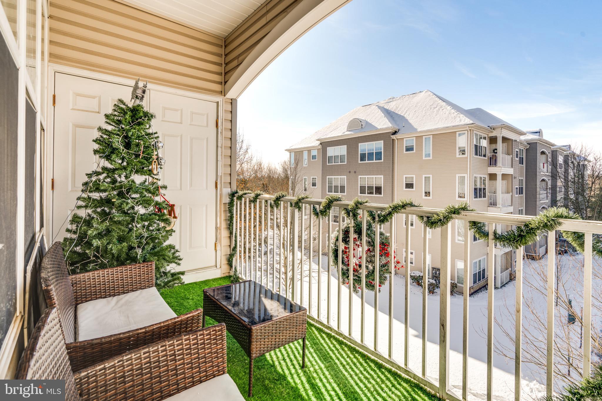 235 Masterson Court Ewing, NJ 08618 - Photo 16 of 19 a view of a house with a small yard and furniture