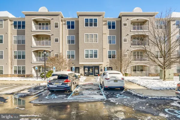 a front view of a building with a street