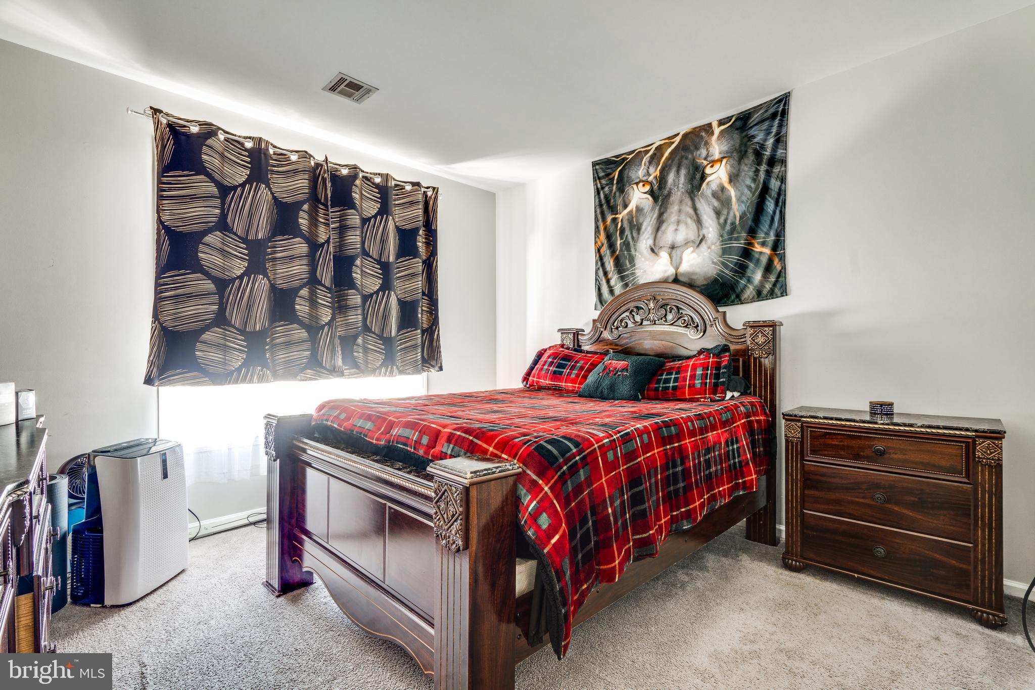 235 Masterson Court Ewing, NJ 08618 - Photo 10 of 19 a bedroom with a bed and a window