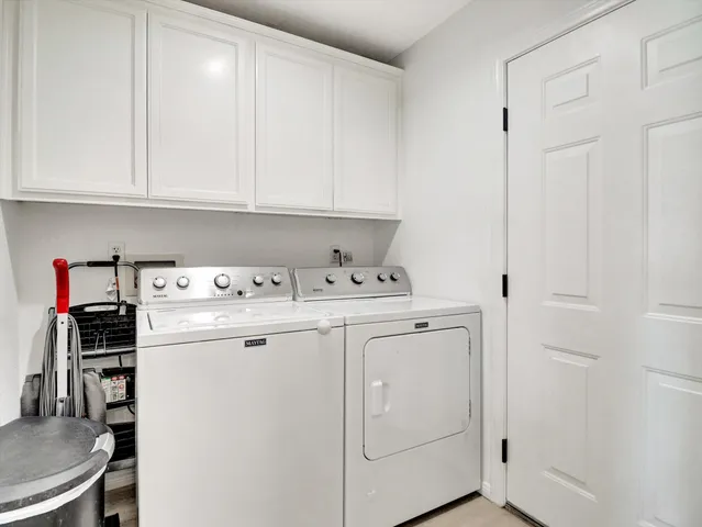 a kitchen with lots of counter space and breakfast area