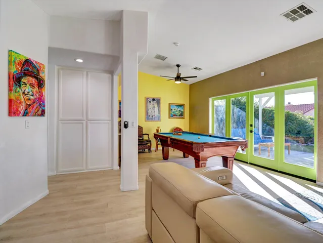 a kitchen with stainless steel appliances a refrigerator sink and cabinets