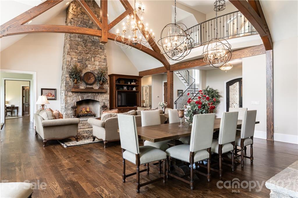 301 Flying Dutchman Road Sylva, NC 28779 - Photo 11 of 48 a view of a dining room with furniture a chandelier and wooden floor